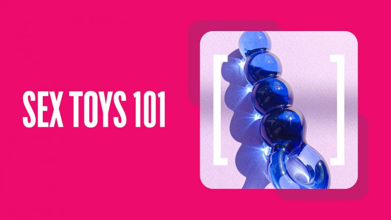 A purple plastic ribbed butt plug sits on a pink background with white text reading 'sex toys 101'