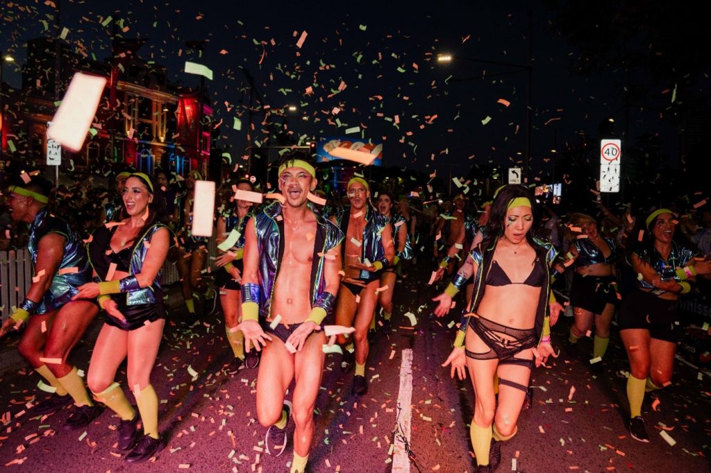 Sydney Mardi Gras Parade dancers celebrate down Oxford Street with confetti falling around them